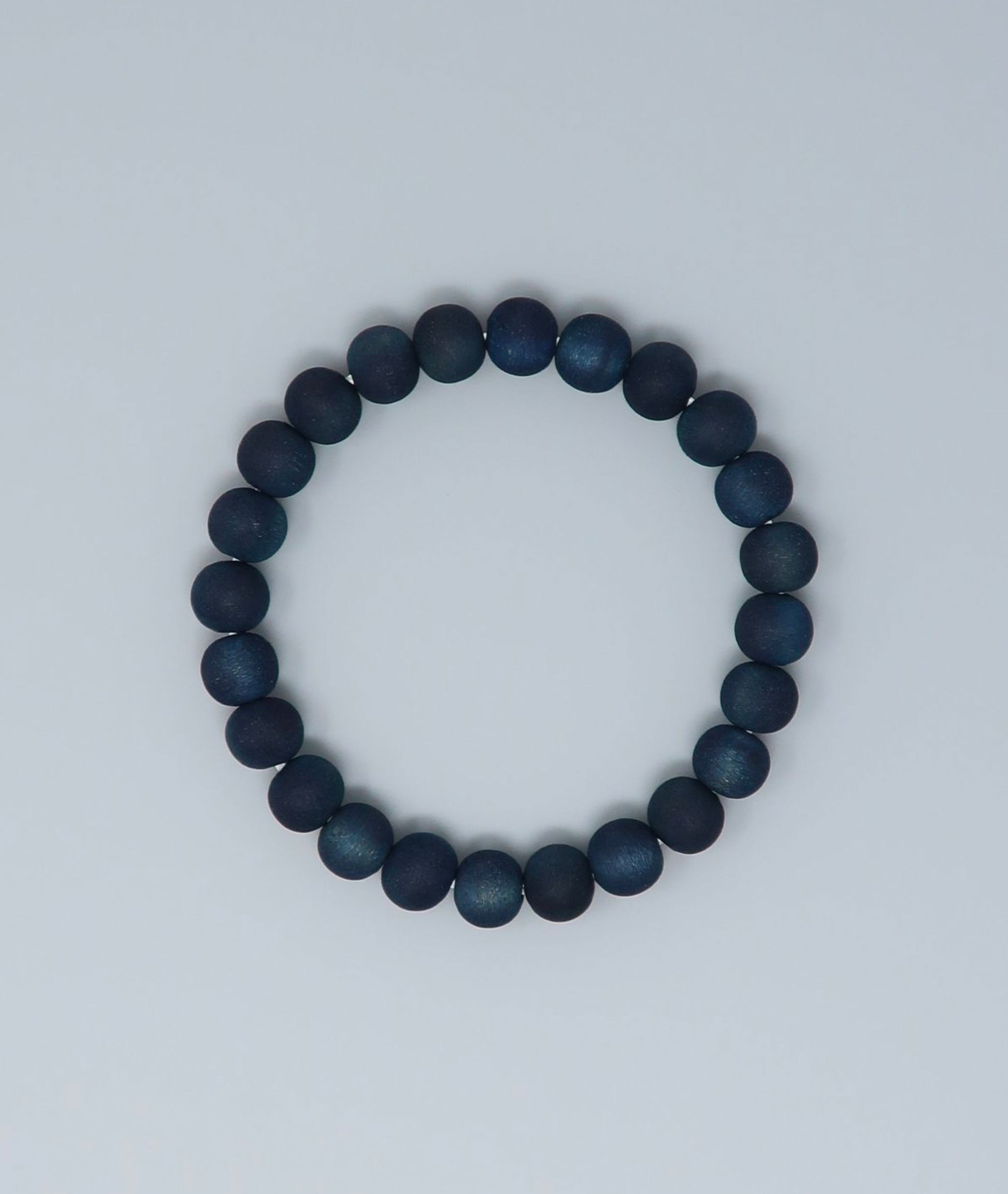 Women's indigo pearl bracelet made from mountain cherry wood, handcrafted in Japan using traditional Sho-Aizome indigo dyeing by Kanbe Juzu of Kyoto; spiritual accessory inspired by samurai, ideal for yoga, prayer, or as a premium gift.