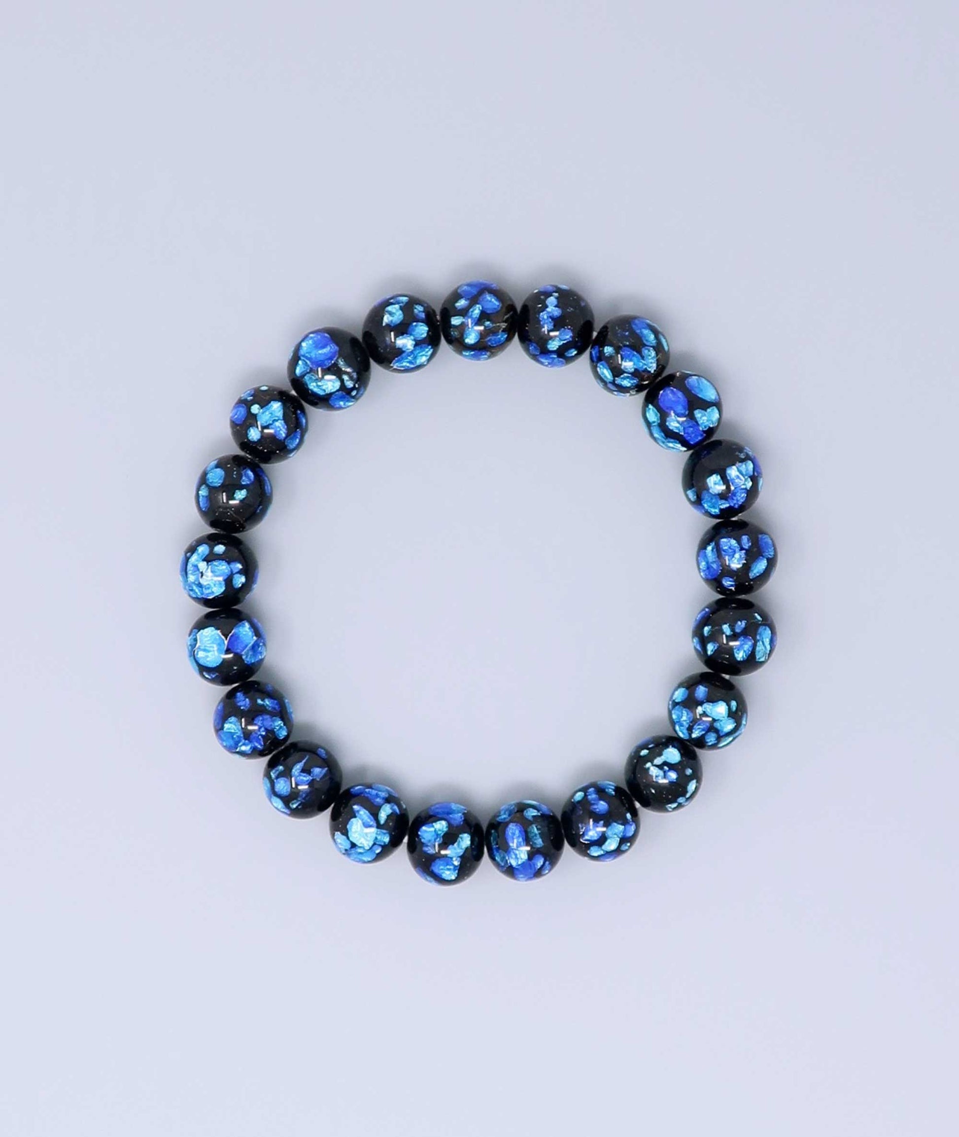 Elegant blue Ryukyu fluorite bracelet with shimmering light blue accents on a jet-black base. Handmade by artisans, combining mystique and luxury. Handcrafted in Japan Kanbe Juzu, ideal for amulet, yoga, meditation, prayer, or gifting.