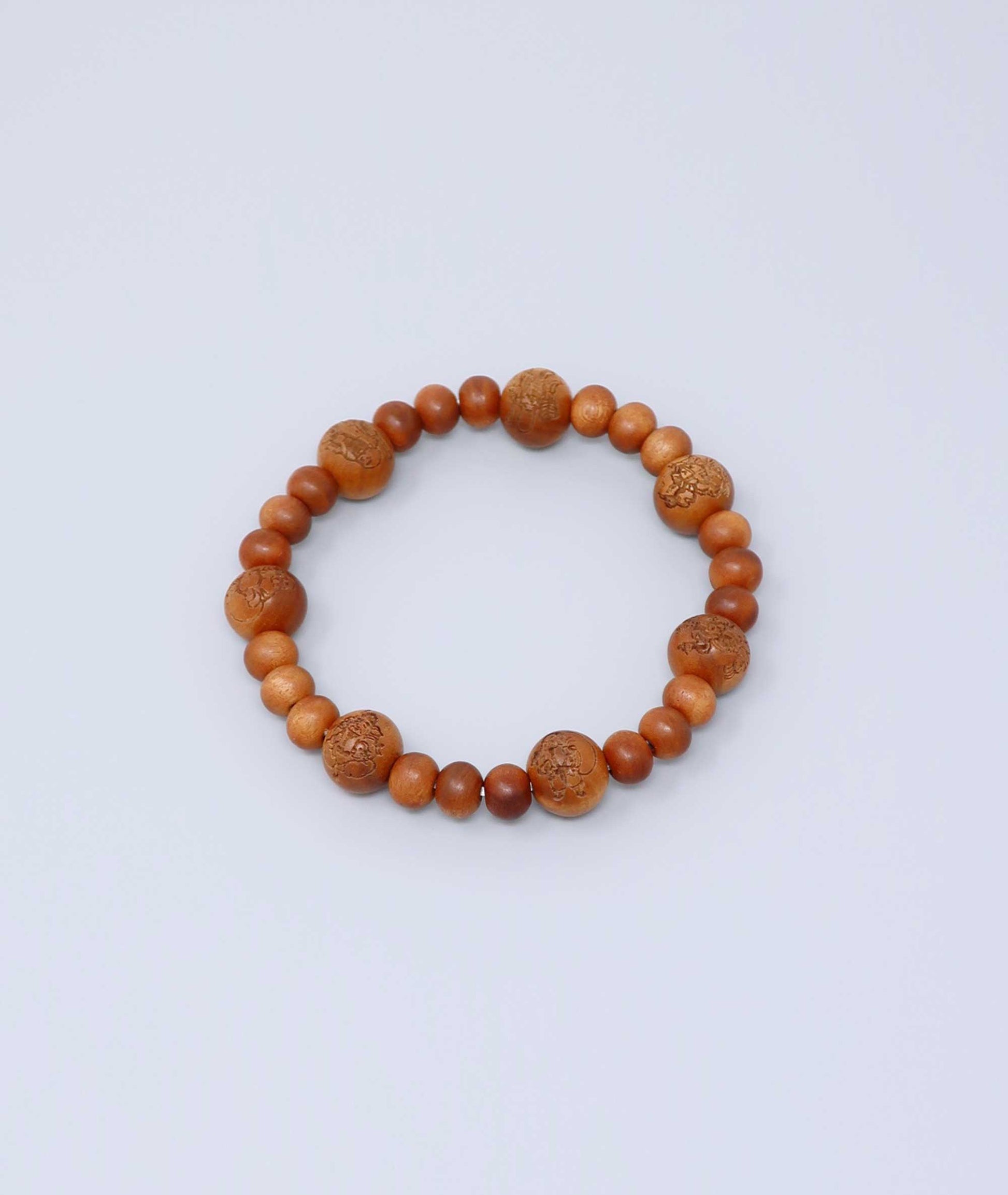Sandalwood prayer beads mala bracelet with carvings of Japan’s Seven Lucky Gods, known for a calming scent and spiritual symbolism. Handcrafted in Japan Kanbe Juzu, ideal for amulet, yoga, meditation, prayer, or gifting.