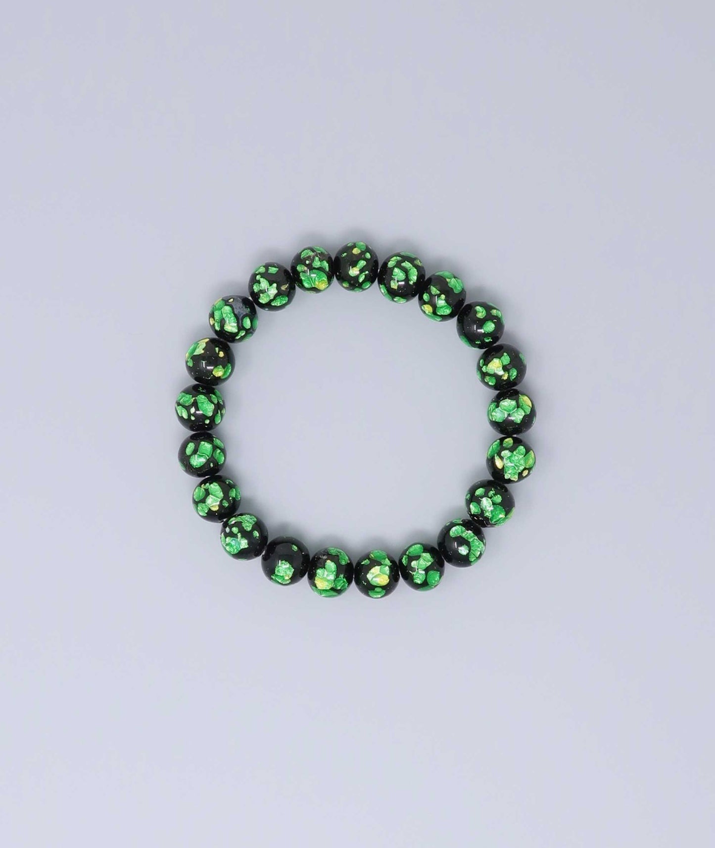 Elegant green Ryukyu fluorite prayer bead mala bracelet with shimmering green accents on a jet-black base. Handmade by artisans, combining mystique and luxury. Handcrafted in Japan Kanbe Juzu, ideal for amulet, yoga, meditation, prayer, or gifting.