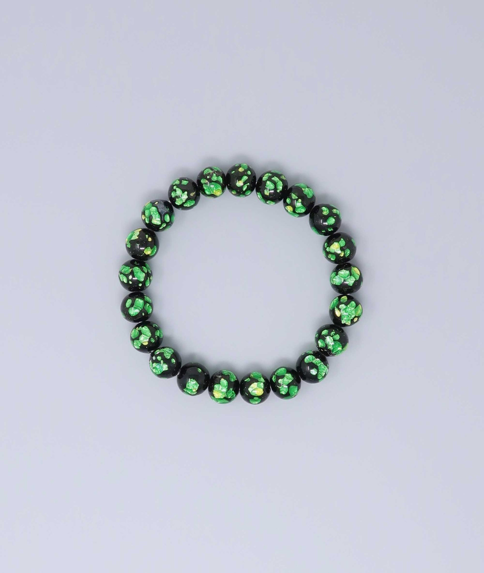 Elegant green Ryukyu fluorite prayer bead mala bracelet with shimmering green accents on a jet-black base. Handmade by artisans, combining mystique and luxury. Handcrafted in Japan Kanbe Juzu, ideal for amulet, yoga, meditation, prayer, or gifting.