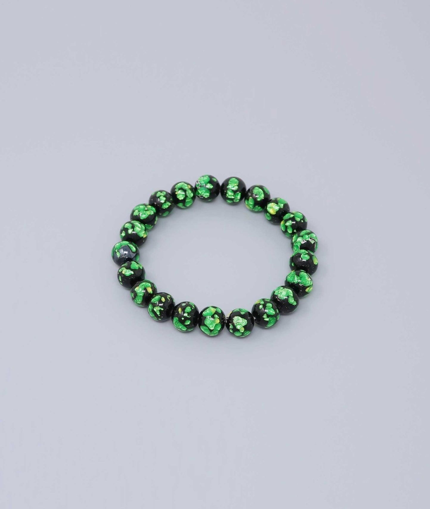 Elegant green Ryukyu fluorite prayer bead mala bracelet with shimmering green accents on a jet-black base. Handmade by artisans, combining mystique and luxury. Handcrafted in Japan Kanbe Juzu, ideal for amulet, yoga, meditation, prayer, or gifting.