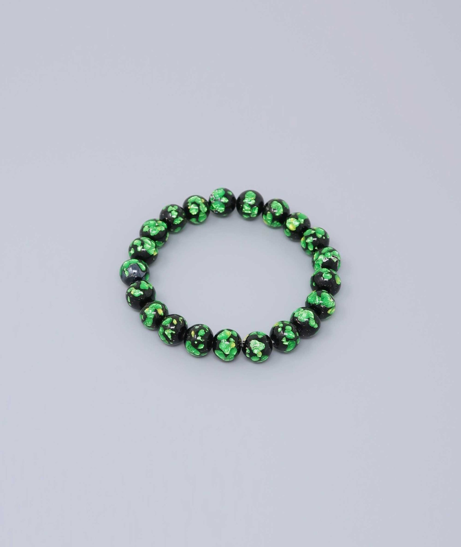 Elegant green Ryukyu fluorite prayer bead mala bracelet with shimmering green accents on a jet-black base. Handmade by artisans, combining mystique and luxury. Handcrafted in Japan Kanbe Juzu, ideal for amulet, yoga, meditation, prayer, or gifting.